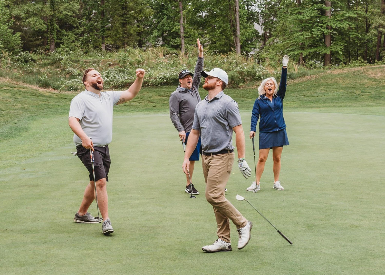 coworkers having fun on golf course 