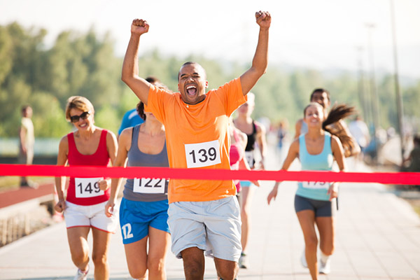 Triumphant man Winning a marathon 